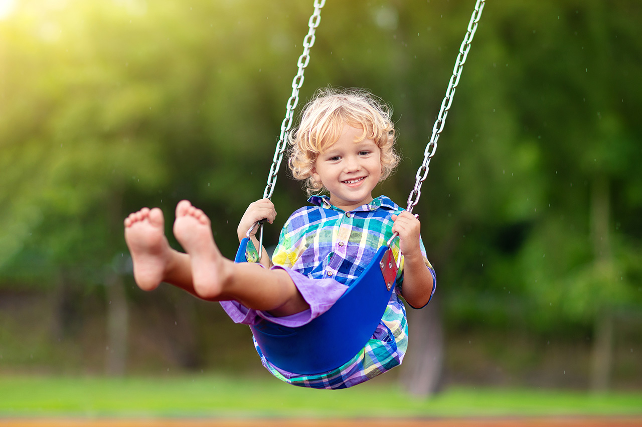 Child-on-playground.-swing-Kids-play-outdoor